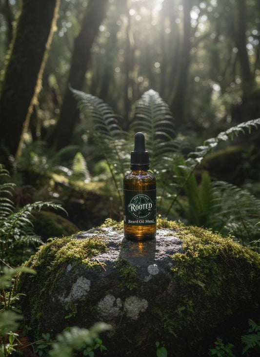 Rooted NZ Nut-Free Natural Beard Oil in amber glass bottle with green 'Rooted NZ' label. Manuka Smoke, Peppered Shore or Unscented